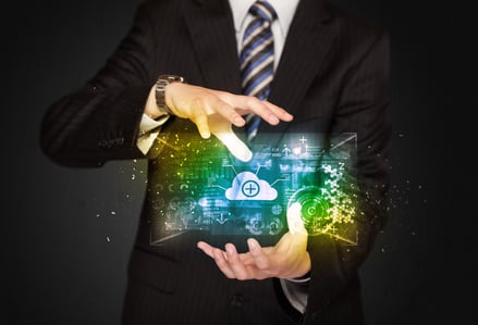 Businessman holding a shining data cloud in front of his body