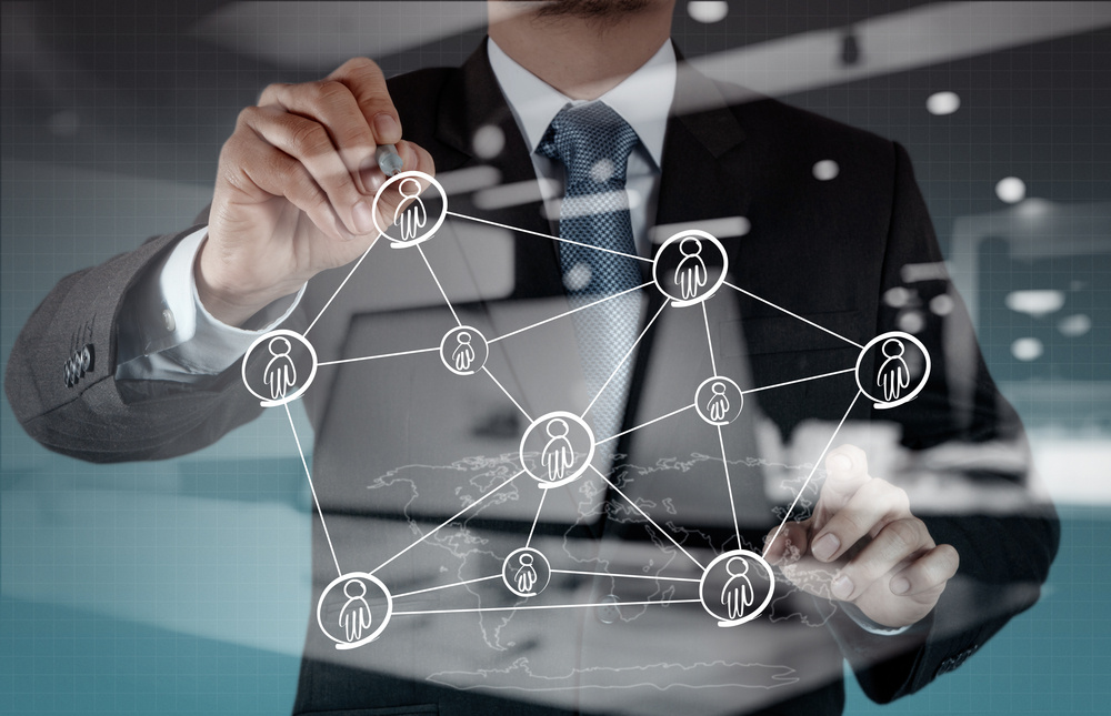 Double exposure of businessman working with new modern computer show social network structure