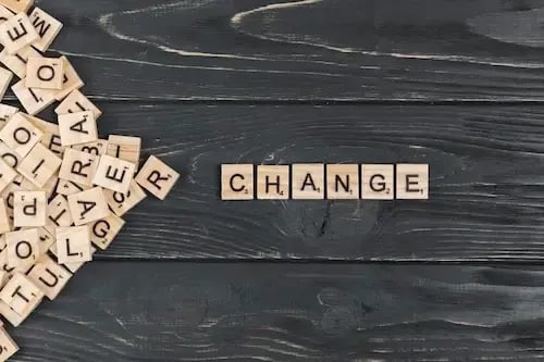 change-word-wooden-background